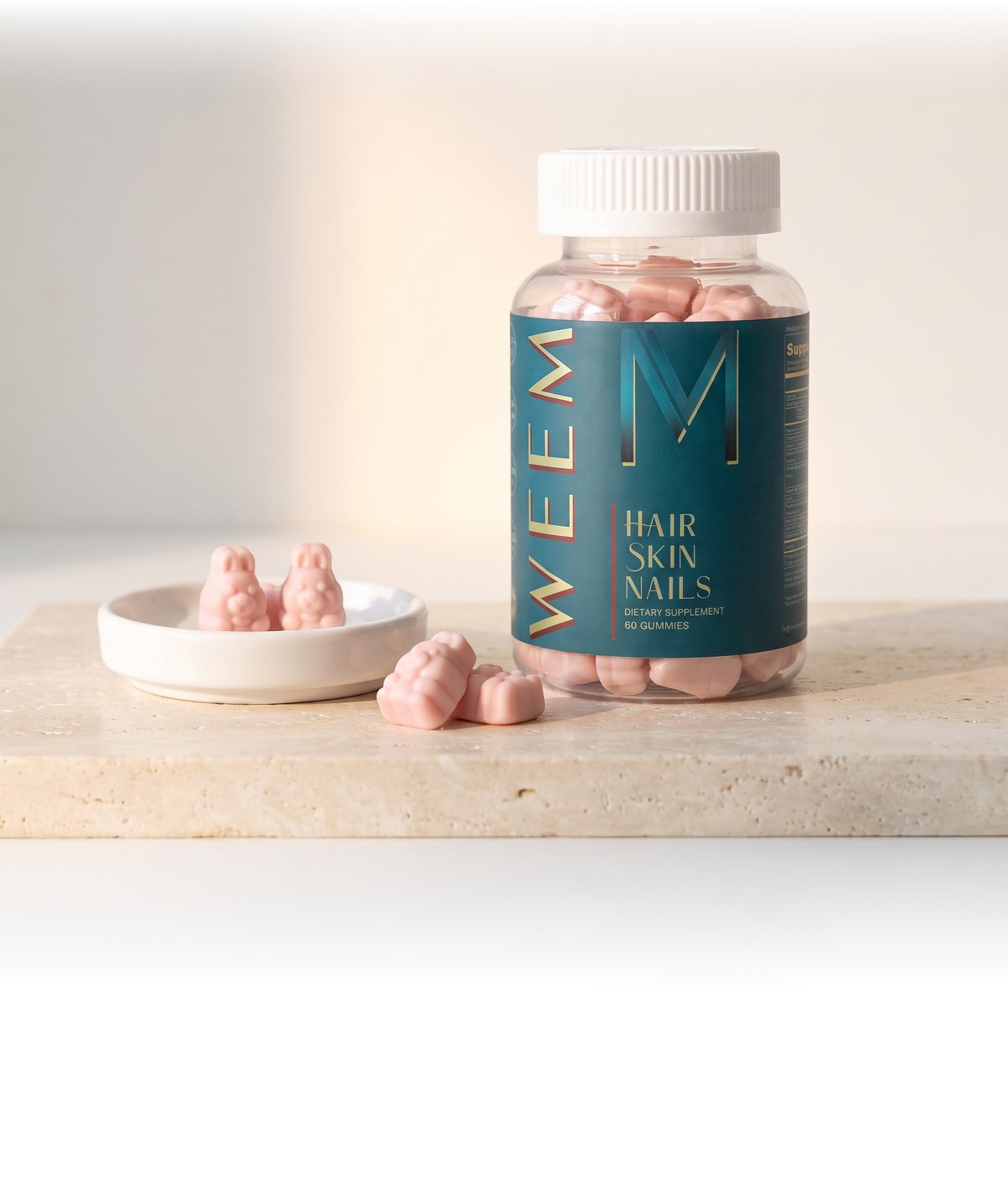 WEEM Hair Skin Nails gummies jar with two pink bunny gummies in a dish