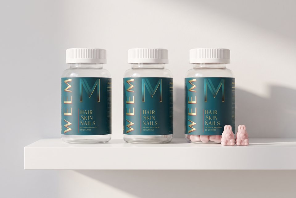 Three WEEM bottles in a row on a bathroom shelf, finished
